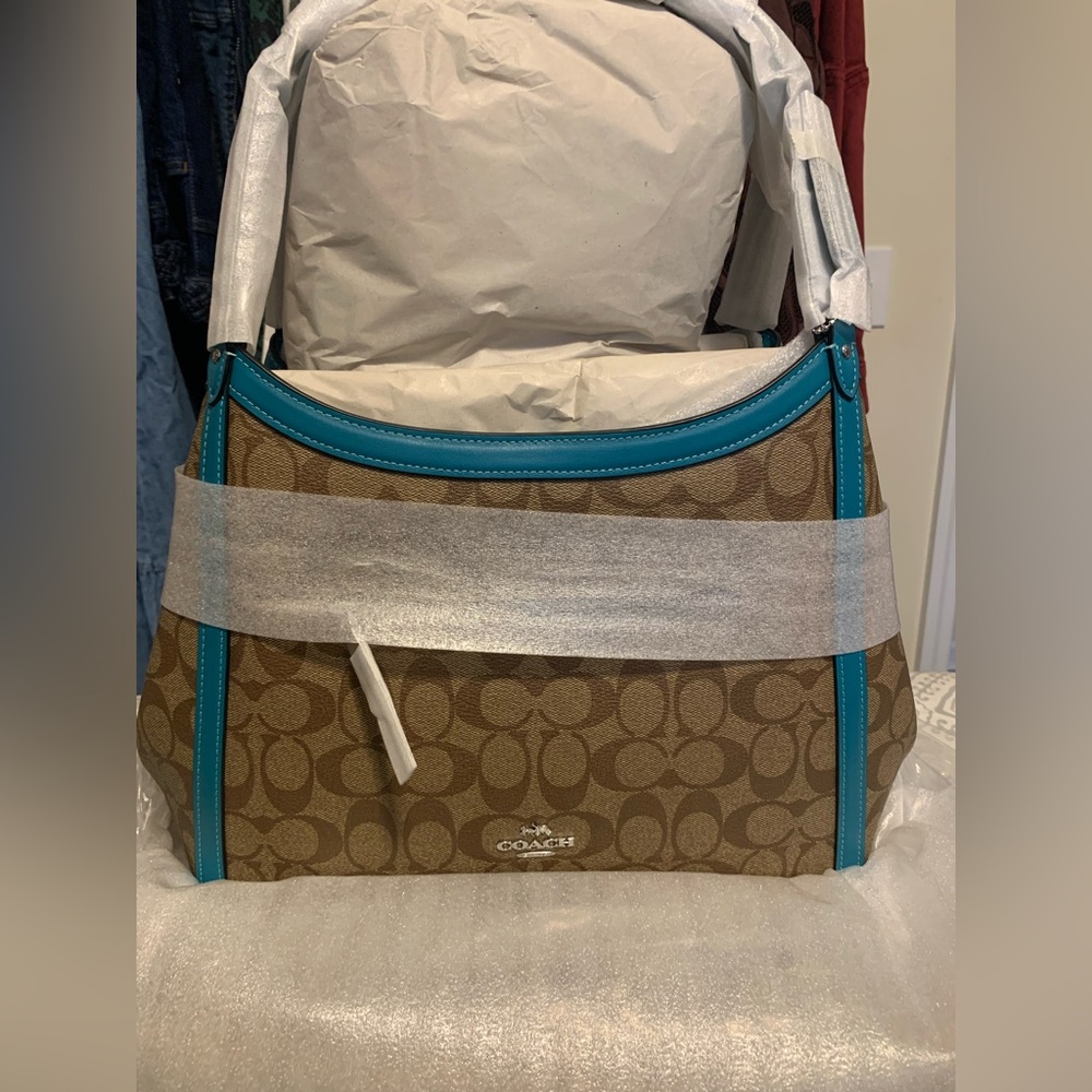 NWT khaki and teal Sig Kristy Coach purse.
